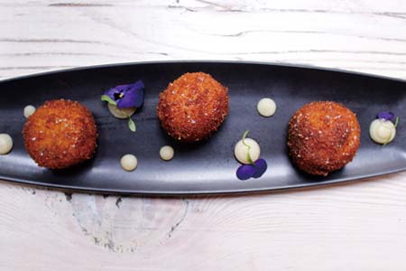 Smoked eel and acorn croquettes in popcorn