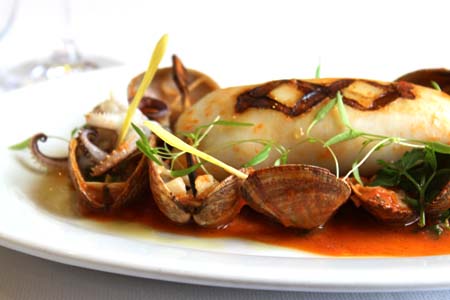 Char-grilled stuffed calamari, clams and tomato