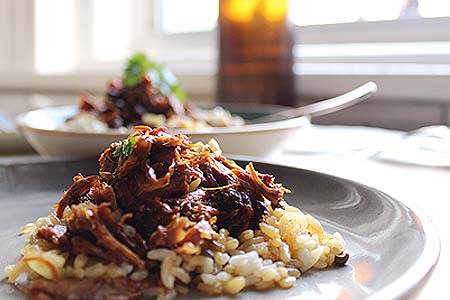 Sticky pulled lamb shoulder with lentil pilaf