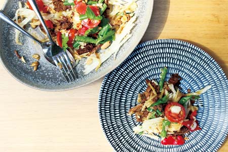 Deep fried green papaya nest, sweet pulled pork, cherry tomatoes, snake beans &amp; spicy dressing